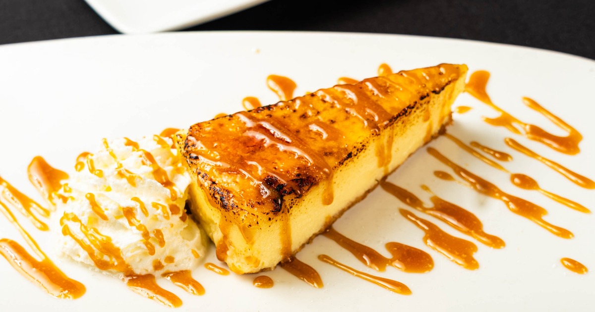 Cheesecake slice drizzled with caramel sauce