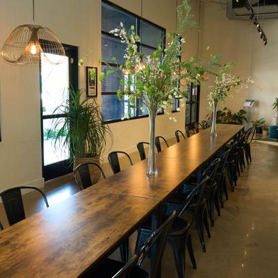 Interior, large table with flower decoration.