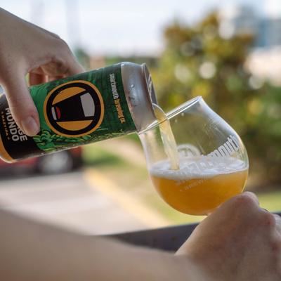 Pouring beer from the can.