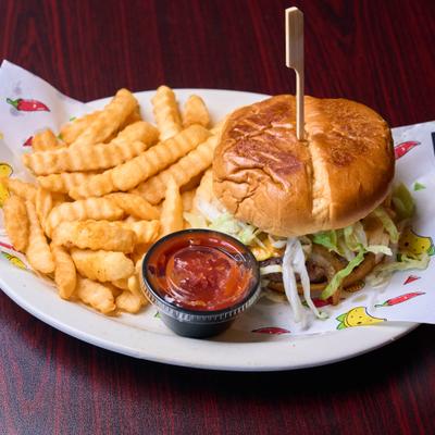 Jalapeno burger served with crinkle cut fries and dipping sauce.