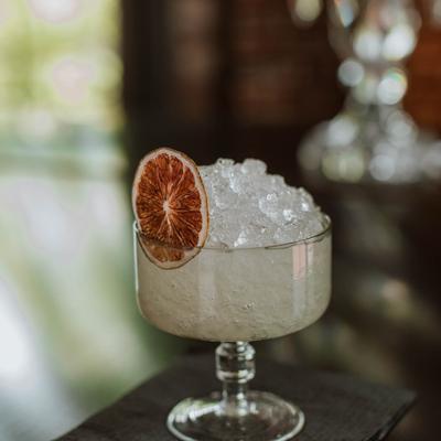 Cocktail in a glass with lots of ice