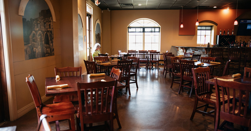 Interior, seating area with a guest sitting at a table