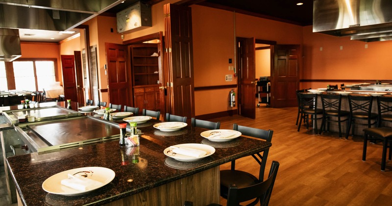 Interior, teppanyaki grill tables ready for guests