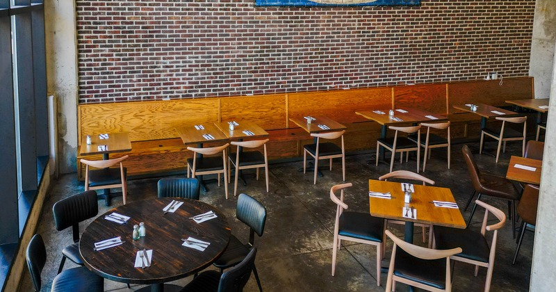 Interior, brick walls and wooden furniture.