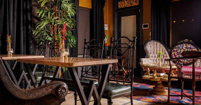 Interior, two tables with vintage chairs, lounge area