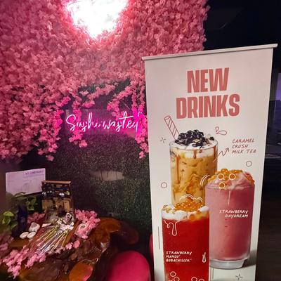 A promotional sign for new bubble tea drinks at Sakura Sushi and Steak.