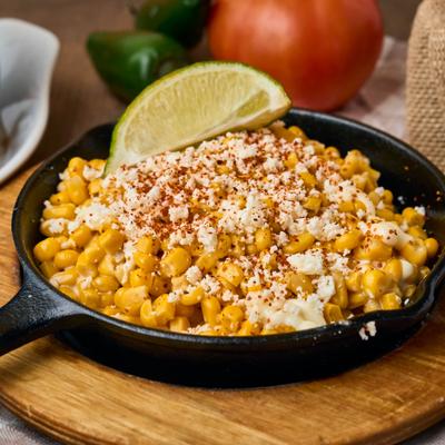 Street corn off the cob with mayo, cheese, and chili powder.