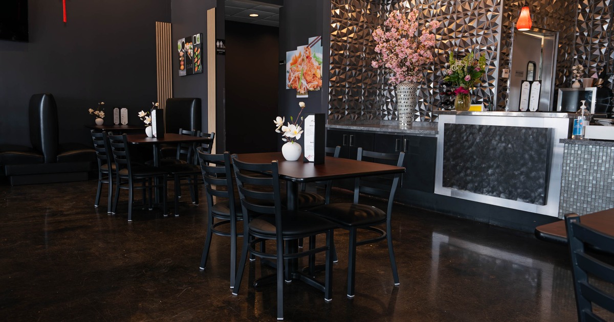 Modern restaurant interior with dark walls
