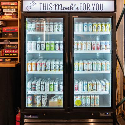 Various beer cans in the fridge.
