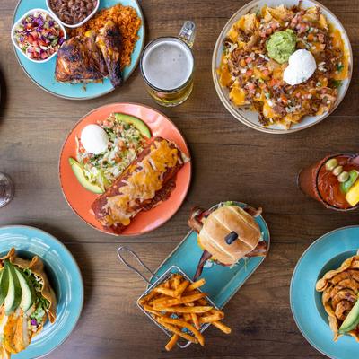 Assortment of dishes served on the table with a glass of beer.