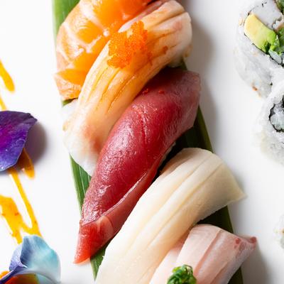 Nigiri sushi and sushi roll combo plate.