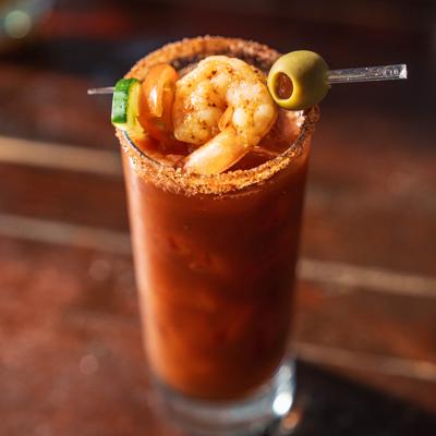 Bloody Mary with shrimp garnish.