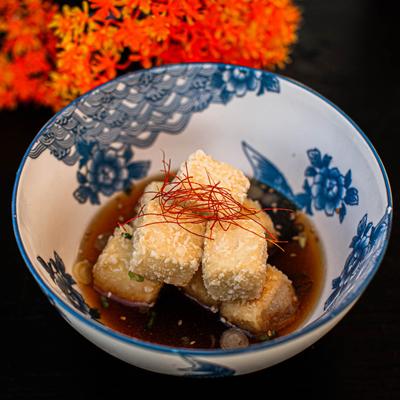 Fried tofu cubes served in a savory broth