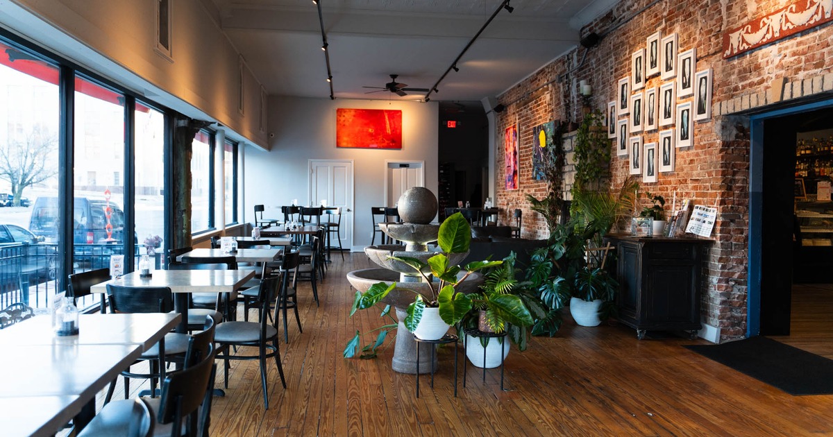 Interior, dining area, marble top tables with chairs, fountain as decoration
