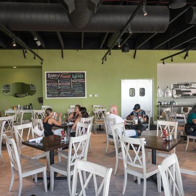 Tables and chairs, guests.