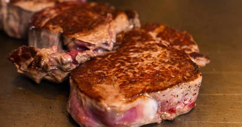 Steak cooking on grill