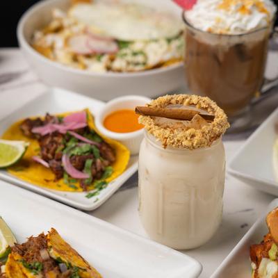 Coffee drinks and food plates.