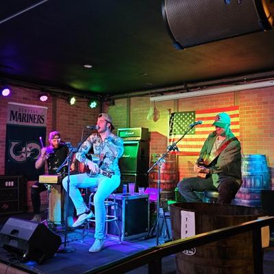 Interior, A band performing on a stage.