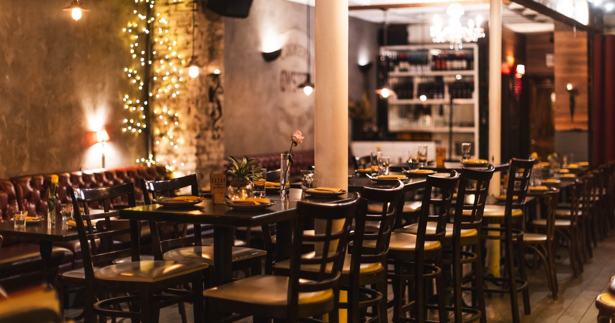 Interior, dining area, closeup on a high seating tables with chairs, ready for guests
