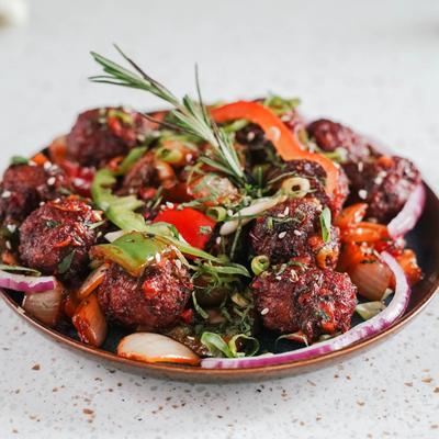 Fried veggie crispy balls cooked with peppers & onion.