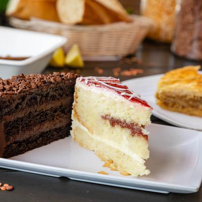 Two pieces of cake served on plate