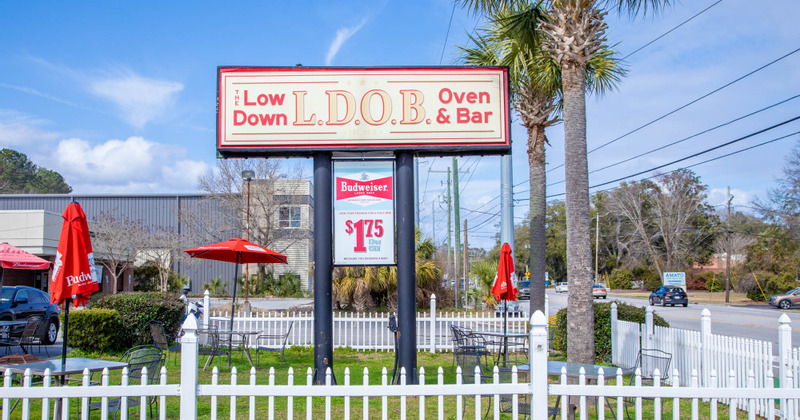 Exterior, the restaurant's sign in the patio