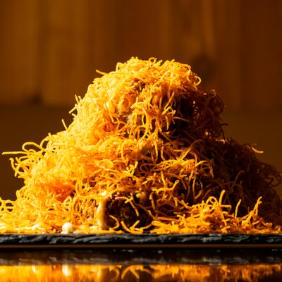 Nickel Plate Roll topped with curly fried sweet potato.