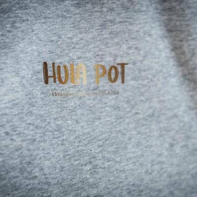 ''Hula Pot'' logo on the light gray hoodie, zoomed in.