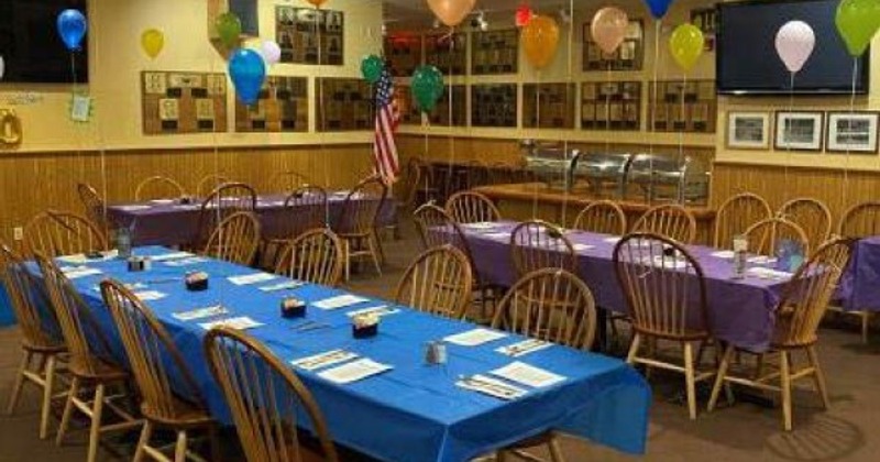 Interior with arranged tables and chairs for a party celebration