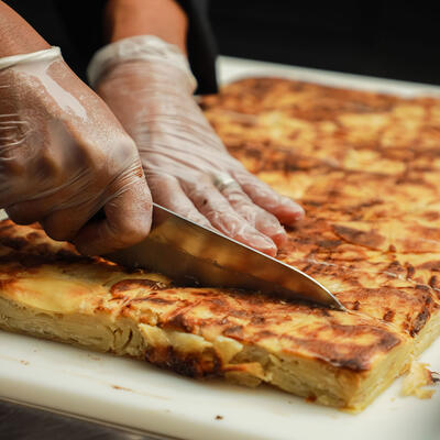 Staff member preparing food for the guests