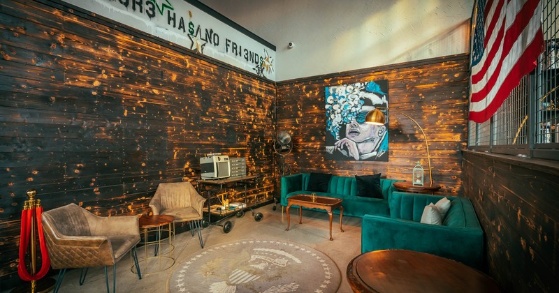 Interior, seating area with a table, sofa and armchairs