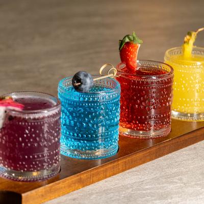Margarita flight served on a wooden tray.