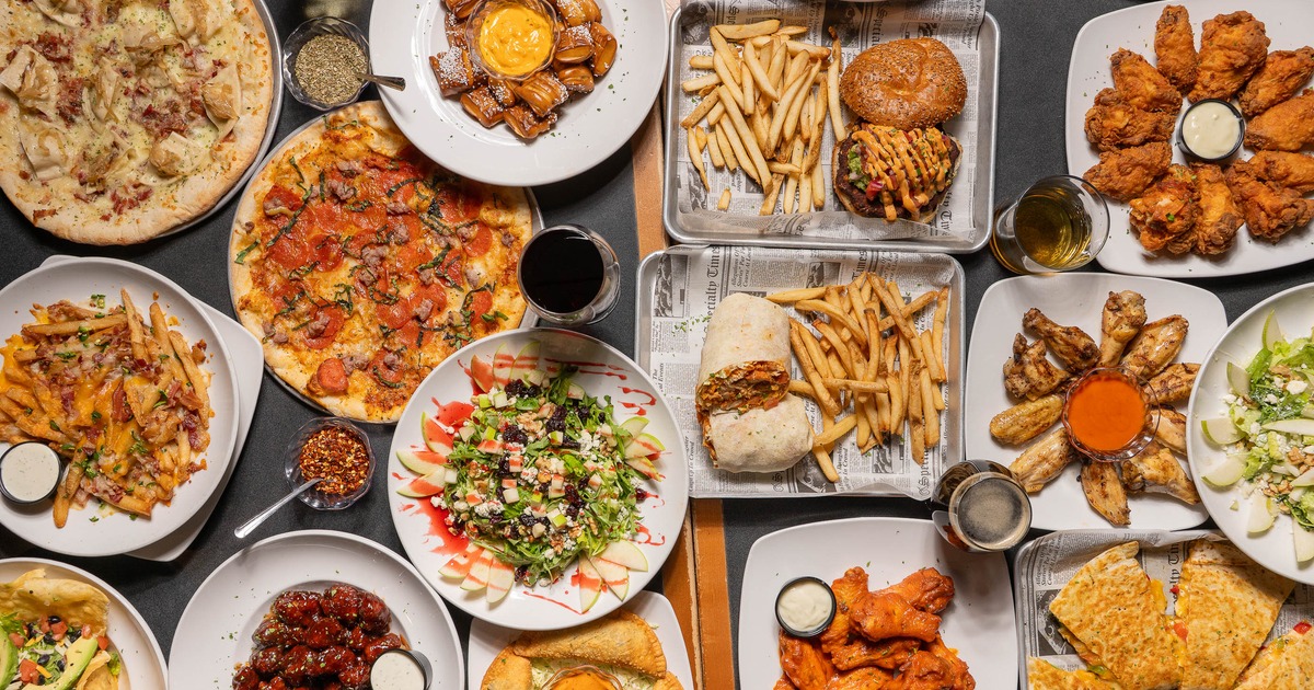 Assortment of dishes served on the table alongside drinks