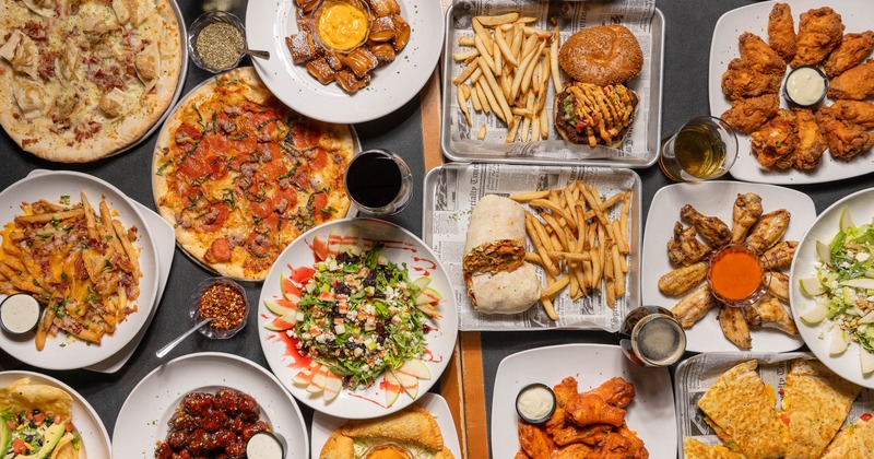 Assortment of dishes served on the table alongside drinks