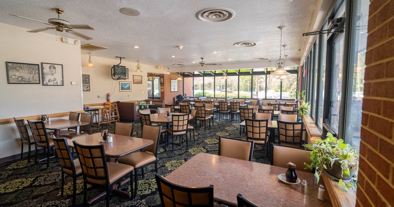 Inside, seating area, tables ready for guests