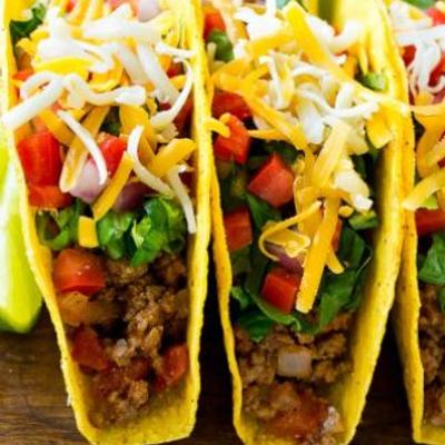 Tacos with ground beef, mixed vegetables and cheese