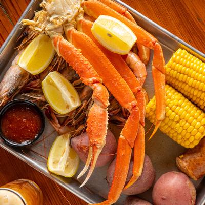 Snow crab legs, boiled shrimp, corn, potatoes, & sausage.