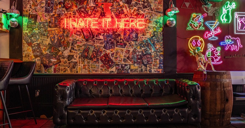 Interior, couch, decorated wall, light sign on
