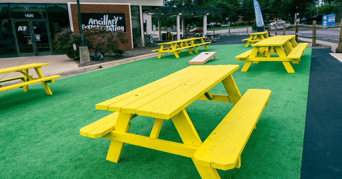Exterior,  benches and tables on green carpet