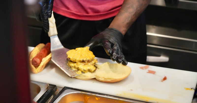 Chef preparing a cheeseburger