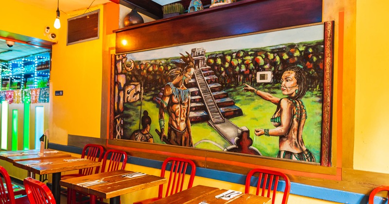 Interior, dining tables and a mural