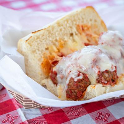Meatball sandwich with pizza sauce and mozzarella cheese.