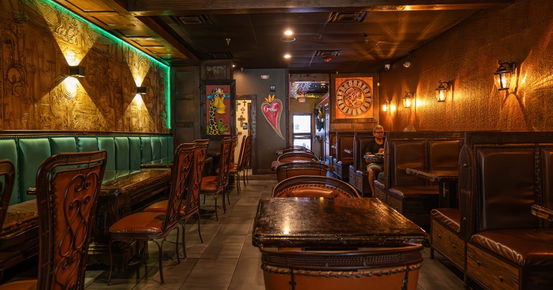 Inside, dining tables, chairs, booths, long banquette seating