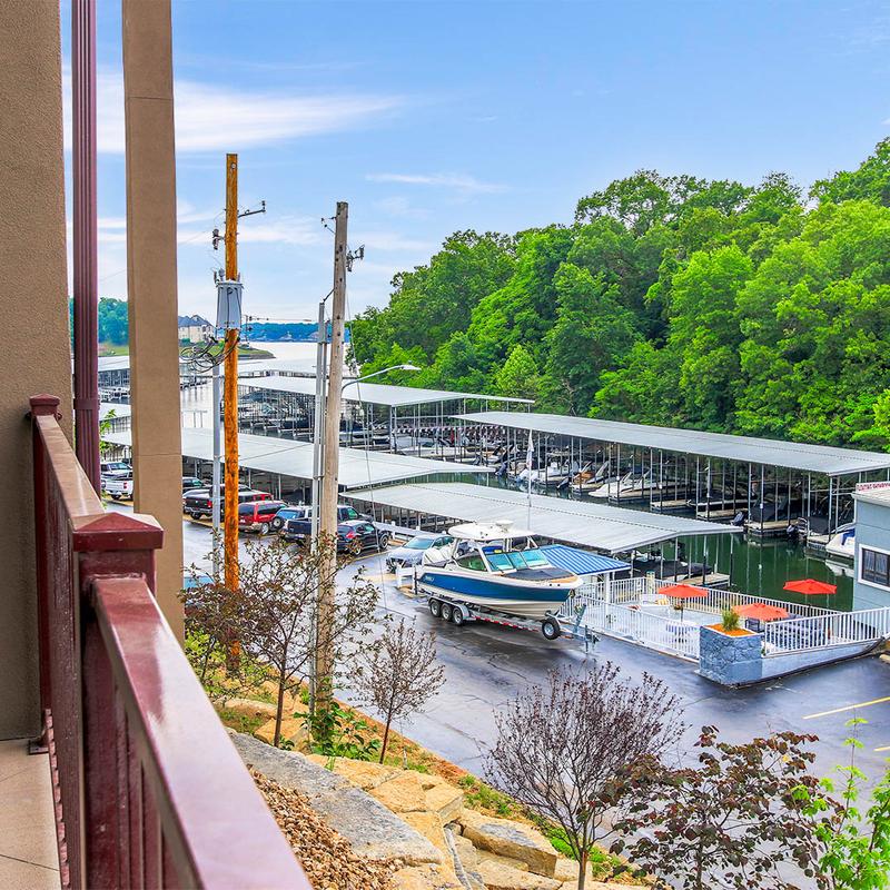 A view over the bedroom balcony on the parking lot and the forest.