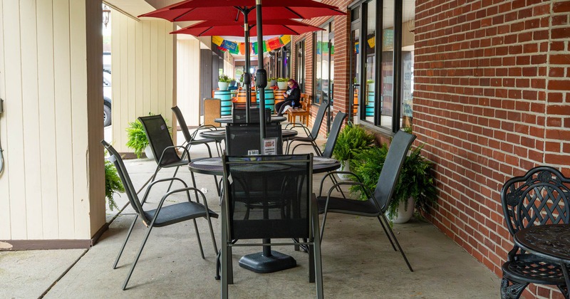 Exterior, tables with parasols and chairs