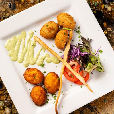 Fried malanga and corn fritters, top view.