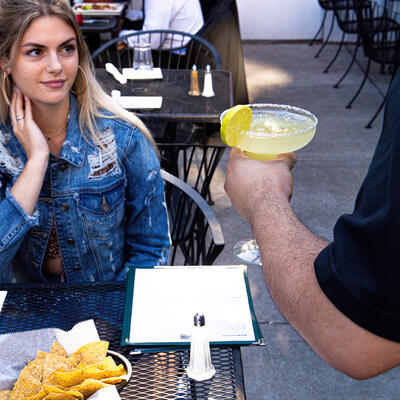 One of guests drinking cocktail