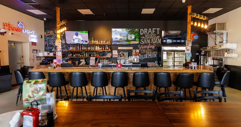 Interior, bar, front view, stools, drink rack behind
