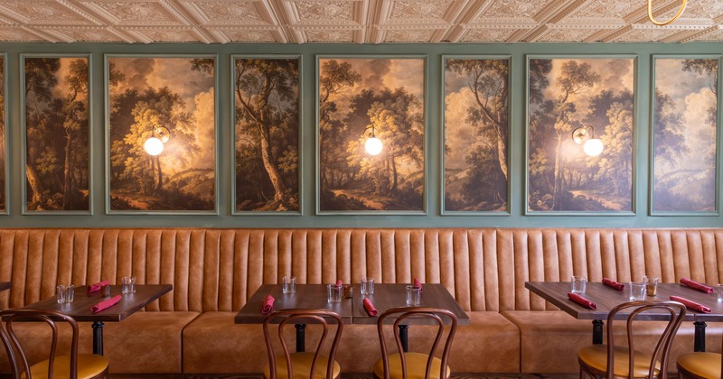 Lined up dining tables set for guests