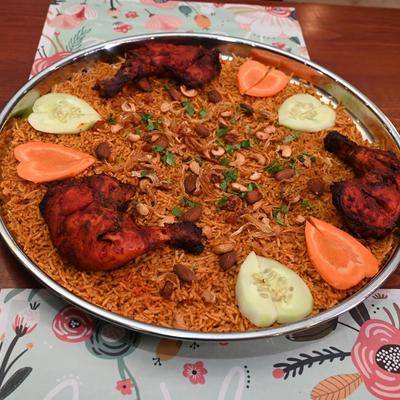 Slow cooked chicken infused with aromatic spices, served over a bed of rice.